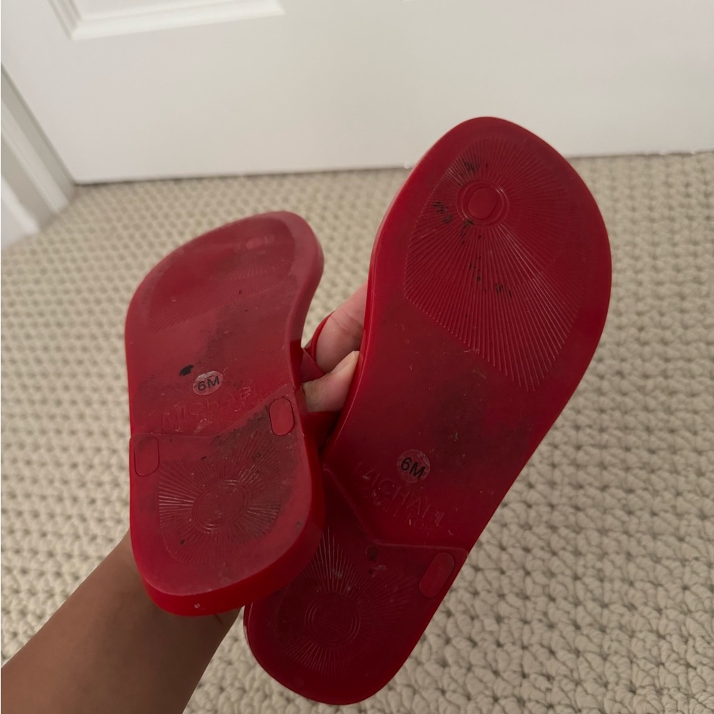 Michael Kors Red Flip Flops with Gold Emblem - Picture 2 of 4